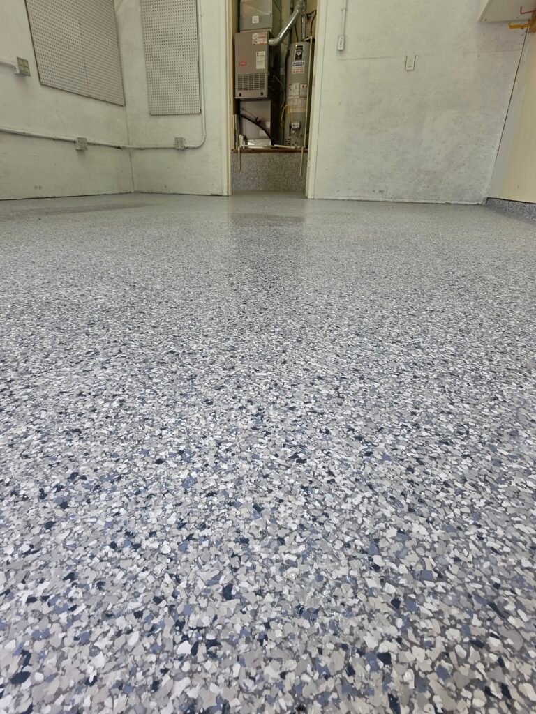 Epoxy Garage with flake system and polyaspartic top coat in Harris Ranch.